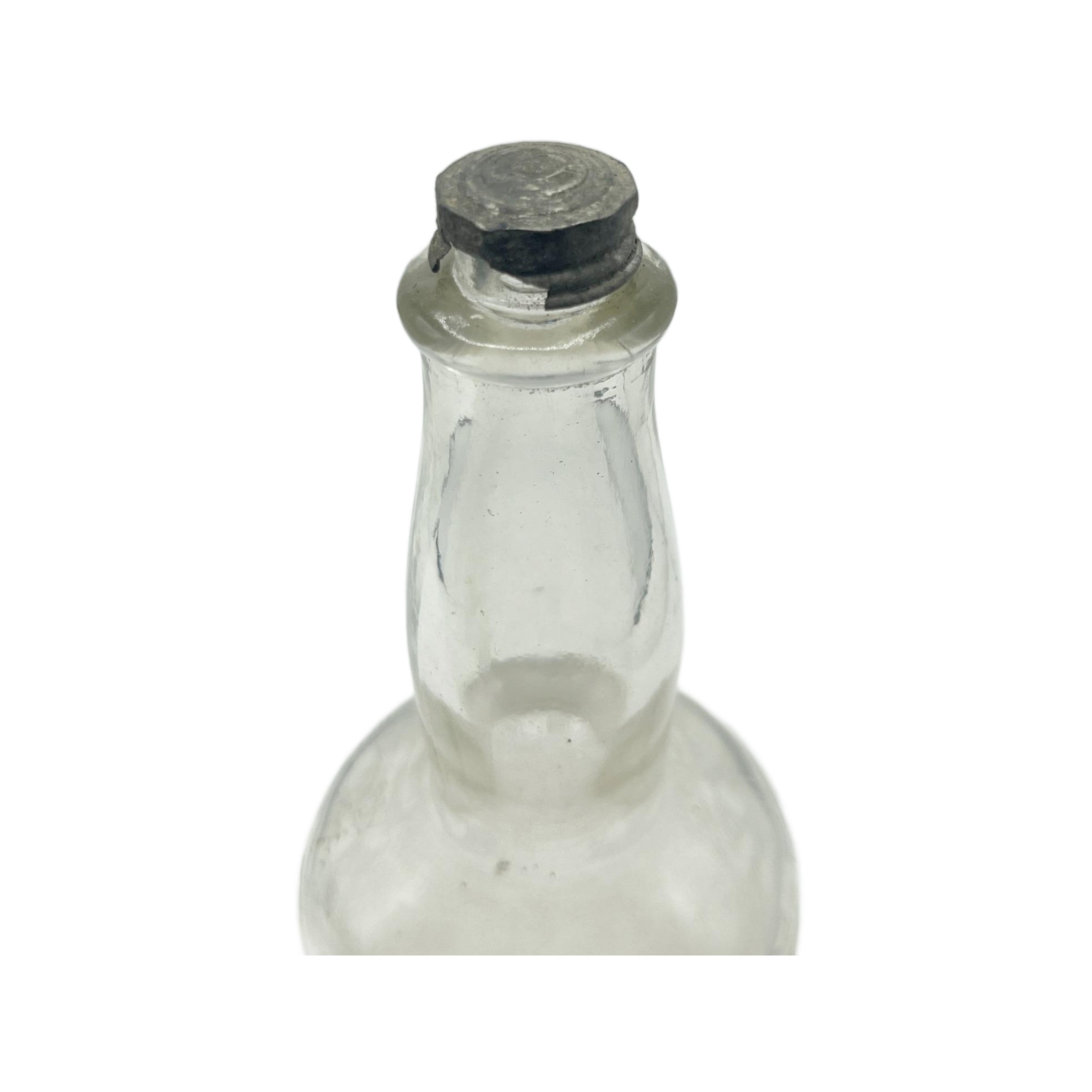 Antique Clear Glass Embossed Barbers Bottle 